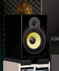 Studio monitor on heavy-duty acoustic foam cushion isolation pads reducing vibration, 5 to 12 inch fit, non-slip setup for home studios.