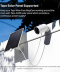 MagCam 2K Plus Outdoor Security Camera with solar panel, wire-free battery power, mounted on wall, view of sky.
