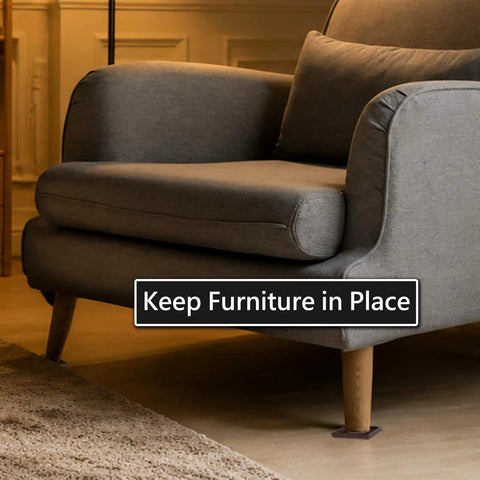 High Performance Non Slip Furniture Cups And Square Caster Pads For Hardwood Floors under a gray sofa, preventing drift and scuffs.