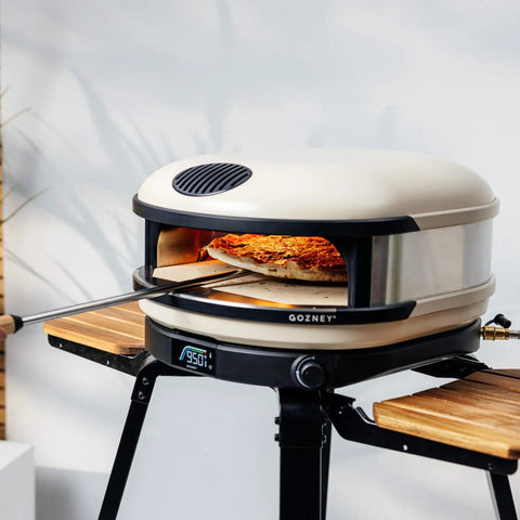 Arc And Arc XL Pizza Oven Stand For Outdoor Use With Locking Wheels Adjustable Wood Wings For Ingredients And Tools Hanging Hooks For Cookware Sturdy Steel Frame Easy Mobility And Secure Oven Support.