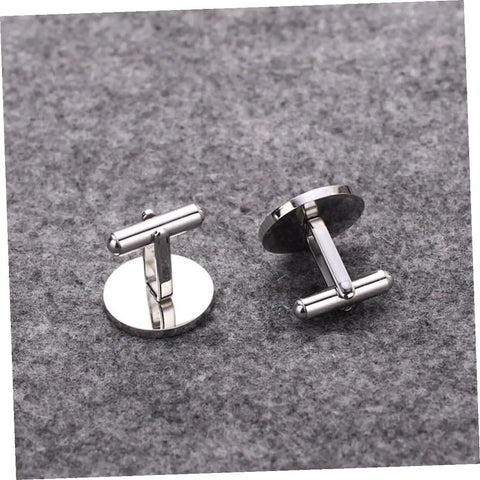 Cross Pattern Titanium Steel Cufflinks For Men Black Polished Shirt Buttons placed on gray fabric surface