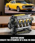 V8 Engine Model Kit That Runs with USB motor and clear pistons, on display in front of a TV showing a classic yellow car.