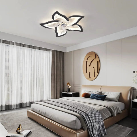 Modern bedroom with flush mount ceiling fan with LED lights and artistic design on white ceiling.
