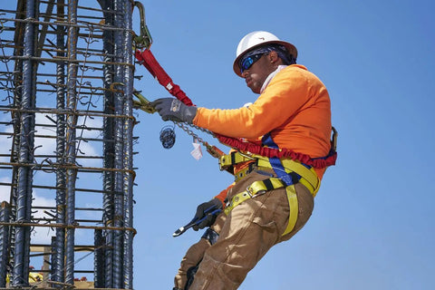 Construction worker using Premium WorkMaster Safety Harness With Tongue Buckles And Three D Rings Polyester Nylon Construction Gear For Go To Fall Protection On Construction And Industrial Job Sites X Large