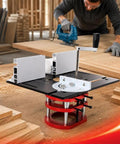 Rock Solid CNC Aluminum Router Table Lift System Featuring Smooth Anodized Finish And Two Inch Stroke Giving Dead On Millimeter Micro Adjustment For Serious Woodworking Tasks in workshop with router in use.