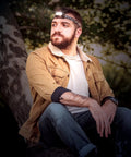 Man wearing Rechargeable USB LED Headlamp with Dual 3W LEDs, water resistant build, adjustable comfort strap, in outdoor setting.