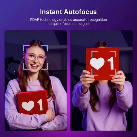 Image of a girl smiling with a bright ring light and showing a red sign with heart and number, demonstrating Instant Autofocus.