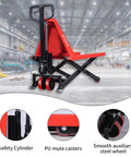 Heavy Duty Manual Scissor Pallet Jack Truck With A Breezy 3300 Pound Lift Capacity And Straight Forward Hydraulic Pump in a warehouse.