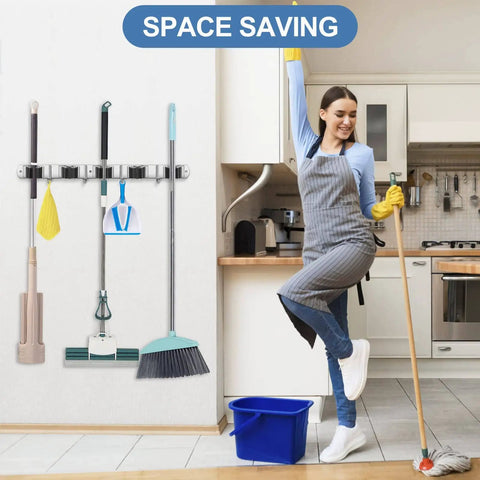 Stainless Steel Wall Mounted Broom And Mop Holder With Five Racks And Four Hooks Self Adhesive Heavy Duty Storage Organizer in kitchen