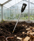 2-In-1 Soil Moisture Meter And PH Tester With A 12 Inch Probe in greenhouse soil, highlighting garden use and earthworms in the soil.