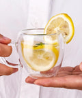 Person holding Six Pack Double Wall Insulated Espresso Cup With Handle Clear Borosilicate Glass Shot Glass Heat Resistant