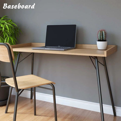 Peel And Stick Baseboard Trim With Self Adhesive Chair Rail Molding Made From Hardened Rubber, shown under desk with chair