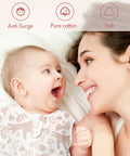 Smiling baby in Arms Up Newborn Swaddle Sleep Bag 0-3 Months with mother on bed, breathable pink bunny design 2-pack.