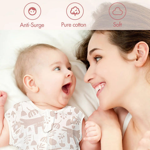 Smiling baby in Arms Up Newborn Swaddle Sleep Bag 0-3 Months with mother on bed, breathable pink bunny design 2-pack.
