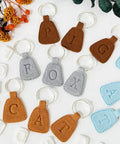 Dope 26 Piece Alphabet Polymer Clay Cutters Set Uppercase Letters For Polymer Clay Molds And DIY Crafts Durable Plastic Tools With Clean Edges For Precise Cutting Leather Fondant Baking on keychains spelling PIG, FOX, CAT.