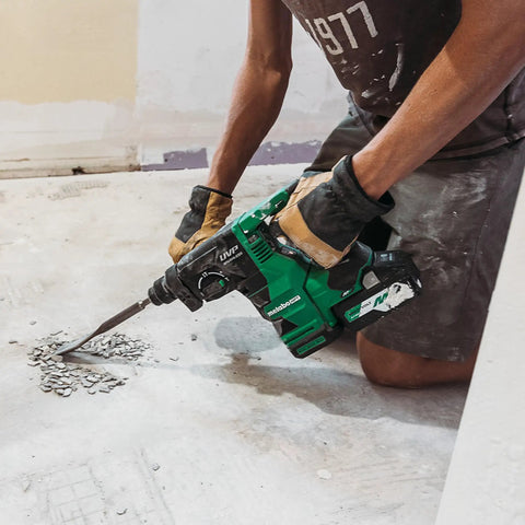 Person using 18V MultiVolt Rotary Hammer Tool Body Only No Battery Included With 1-1/32 Inch SDS Plus Chuck for demolition