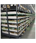Industrial shelf storing New In Box PW6K1R2 Dual Reader Board for automation, plug and play setup, sensor modules neatly organized