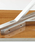 Heavy Duty Stainless Steel Triangle Shelf Brackets Pack Of Two Built Like A Tank resting on wood surface for corner supports.