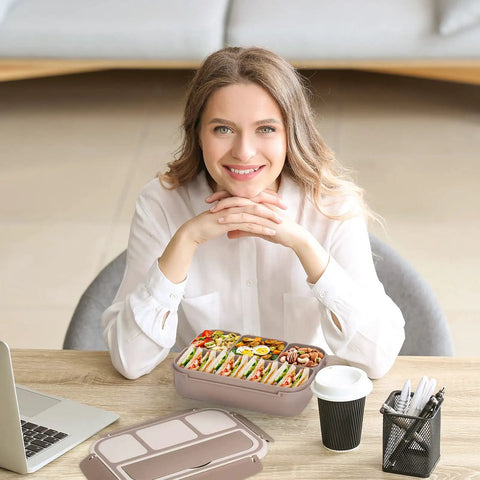 Woman with All In One Bento Lunch Box For Adults With Four Compartments Includes Utensils Sauce Jar Muffin Liners 40 Ounce Capacity Microwave And Dishwasher Safe Meal Prep Friendly Brown on table