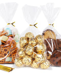 Clear Cellophane Treat Bags 200 Pack 6X10 Inch With Gold Twist Ties For Cookies Candy Birthday Party Favors Graduation And Homemade Bakery Packaging Must Have Bulk Value Pack Food Grade Small Candy Bags showcasing various treats inside.