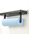 Garage Paper Towel Holder With Shelf And Hooks, black stainless steel wall mount, holds blue paper towel roll.