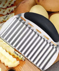 Front-angle view of stainless steel French fry slicer for potatoes with black handle.