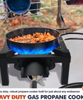 Beast High-Pressure Outdoor Propane Stove With 100,000 BTU Heat cooking seafood on a heavy-duty burner with blue flame.