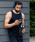 Man holding Global Travel Kettle With Dual Voltage 110-240V, portable electric design, LCD display visible, stainless steel finish.