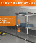 Stainless Steel Prep Table 24 By 30 Inch With Adjustable Undershelf, Backsplash And Wheels in garage setting.