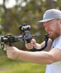 Person aiming crossbow with Easy Install Folding Stock Crossbow Adapter For BAT And BAT Reverse Crossbow outdoors