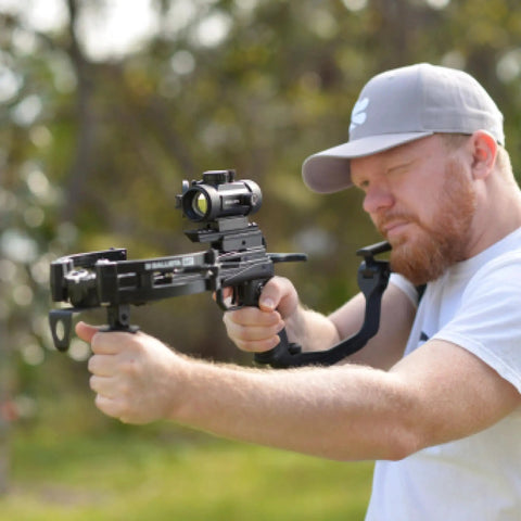 Person aiming crossbow with Easy Install Folding Stock Crossbow Adapter For BAT And BAT Reverse Crossbow outdoors