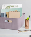 Level Up Your Nest With These Dope Ribbed Plastic Storage Bins A Set Of Eight Spacious Open Baskets perfect for organizing notebooks in lilac bin.
