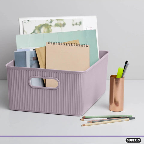 Level Up Your Nest With These Dope Ribbed Plastic Storage Bins A Set Of Eight Spacious Open Baskets perfect for organizing notebooks in lilac bin.