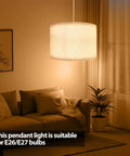 Plug In Pendant Light With 15 Foot Hanging Cord And Toggle Switch Natural Linen Drum Shade E26 Bulb Socket Modern Beige Fixture in cozy living room setting.