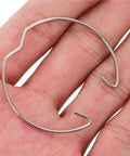 Bingche 40 Pcs MR11 Retaining Spring Rings for MR16 Downlight Panel Lamp Clip Bulb Holder in hand, showcasing metal construction.