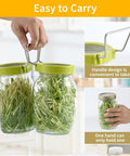 Hand holding Two Pack Seed Sprouter Kit For Wide Mouth Jars With 316 Stainless Mesh BPA Free Drip Tray And Tilted Lid For Bean Sprouts