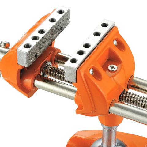 Close-up of Beefy Heavy Duty Clamp Bench Vise with Swivel Base showing metal jaws and orange cast steel body for woodworking.