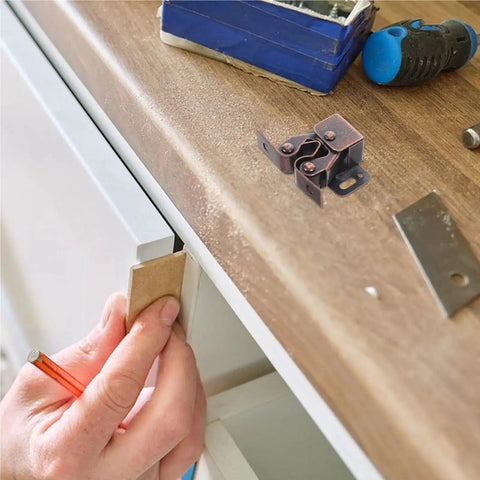 Quiet Roller Cabinet Catch 12 Pack Set installation on wooden cabinet with tools