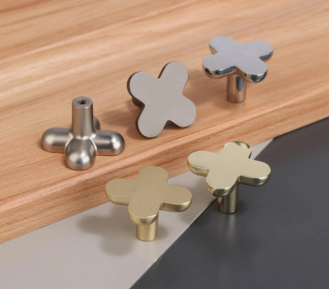 Cross Flower Cabinet Knobs And Drawer Pull Set In Polished Chrome Zinc Alloy Hardware For Cupboard Wardrobe Closet Bathroom 4 Pack With Three Screw Sizes For Easy Install displayed on wooden surface.