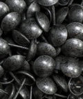 Heavy Duty Upholstery Tacks With A Sweet Antique Pewter Finish For Top Shelf Diy Furniture Fixes And Solid Home Project Upgrades Boasting Badass Durability With 100 Pieces Included close-up of antique pewter tacks