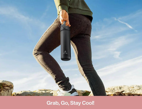 Person holding 26 Oz Stainless Steel Insulated Water Bottle With 2 In 1 Straw And Spout Lid Keeps Drinks Ice Cold All Day Leak Proof