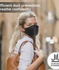 Woman wearing black KN95 Face Masks 50 Pack Breathable Comfort Disposable Respirator Masks For Daily Use Black High Filtration Efficiency