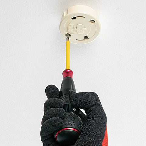 Electric Ball Grip Screwdriver With One Bit, 3.6V Li Ion Battery in use on a ceiling fixture, hand in glove holding the tool