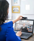 User adjusting Pro Level 4K Ultra HD Webcam Featuring Swift Auto Focus And Snappy 5X Digital Zoom For Crystal Clear Streams Tight Video Calls And A Totally Fresh Remote Work Station Setup on laptop.