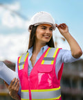 Top Level High Visibility Safety Vest With Bold Reflective Strips And Plenty Of Gear Pockets For Daily Grind, worn by woman outdoors with plans.