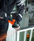 Pro Rig Cordless Angle Grinder With 125 Mm Disc And 18 Volt Brushless Motor Cranks Out 1100 Watts Of Torque in action cutting a metal railing.