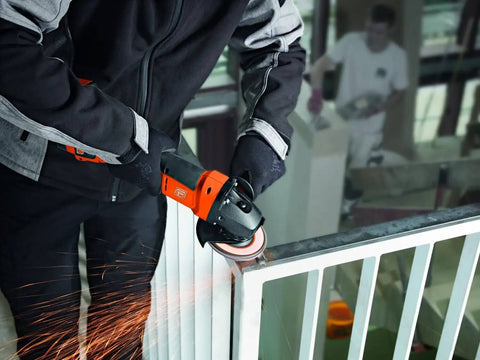 Pro Rig Cordless Angle Grinder With 125 Mm Disc And 18 Volt Brushless Motor Cranks Out 1100 Watts Of Torque in action cutting a metal railing.