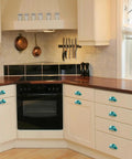 Premium Teal Marble Cabinet Cup Pulls mounted on kitchen drawers with a sleek stone aesthetic and practical 2.6 inch hole centers.