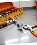 Heavy Duty Stainless Steel U Groove Sliding Door Roller Pulley With Ball Bearings on a workshop table with tools.