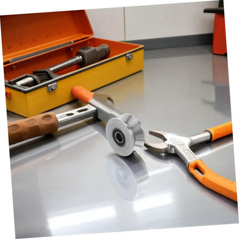 Heavy Duty Stainless Steel U Groove Sliding Door Roller Pulley With Ball Bearings on a workshop table with tools.